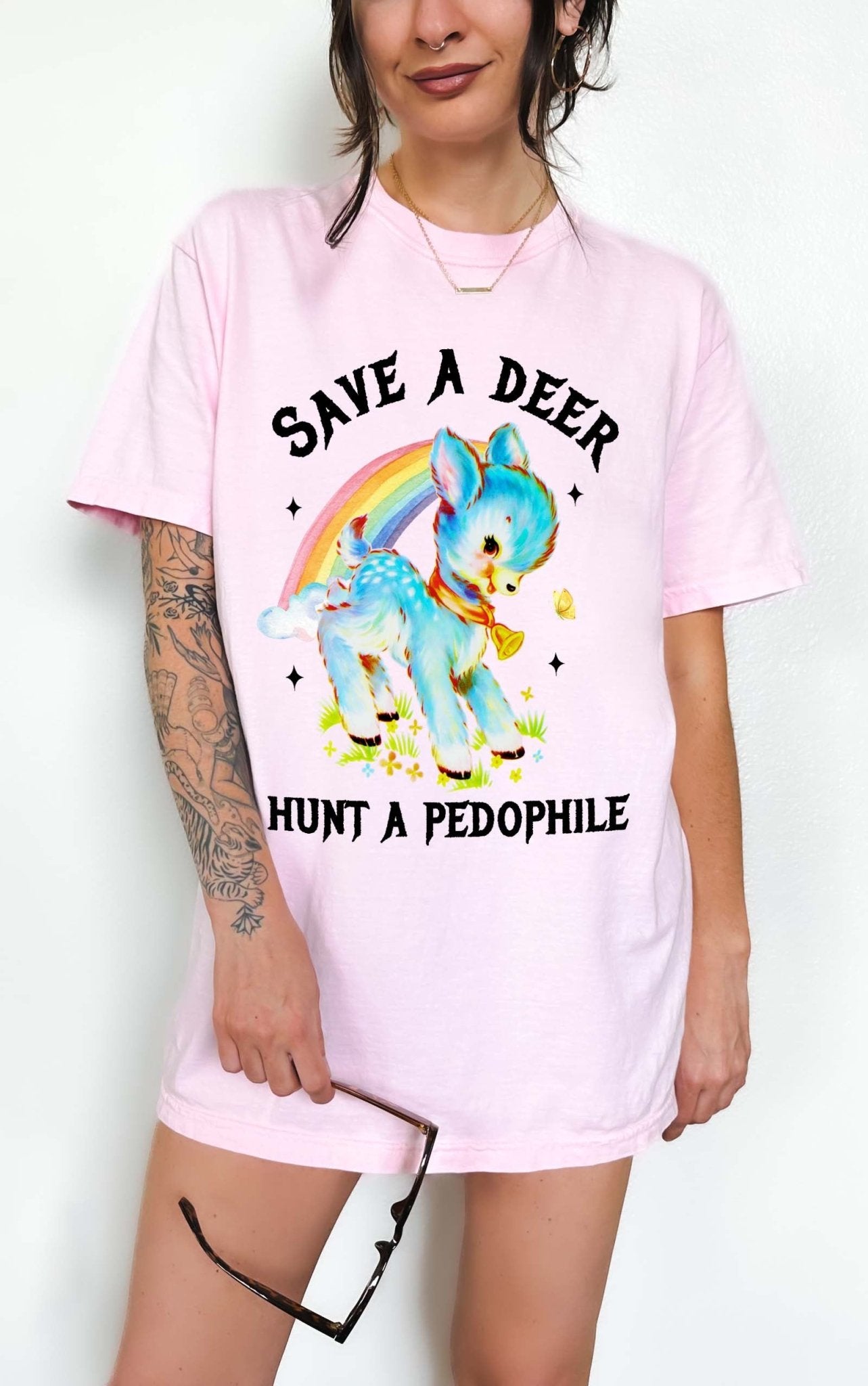 Vintage style deer graphic t-shirt with rainbow design and bold statement text, worn oversized on a model