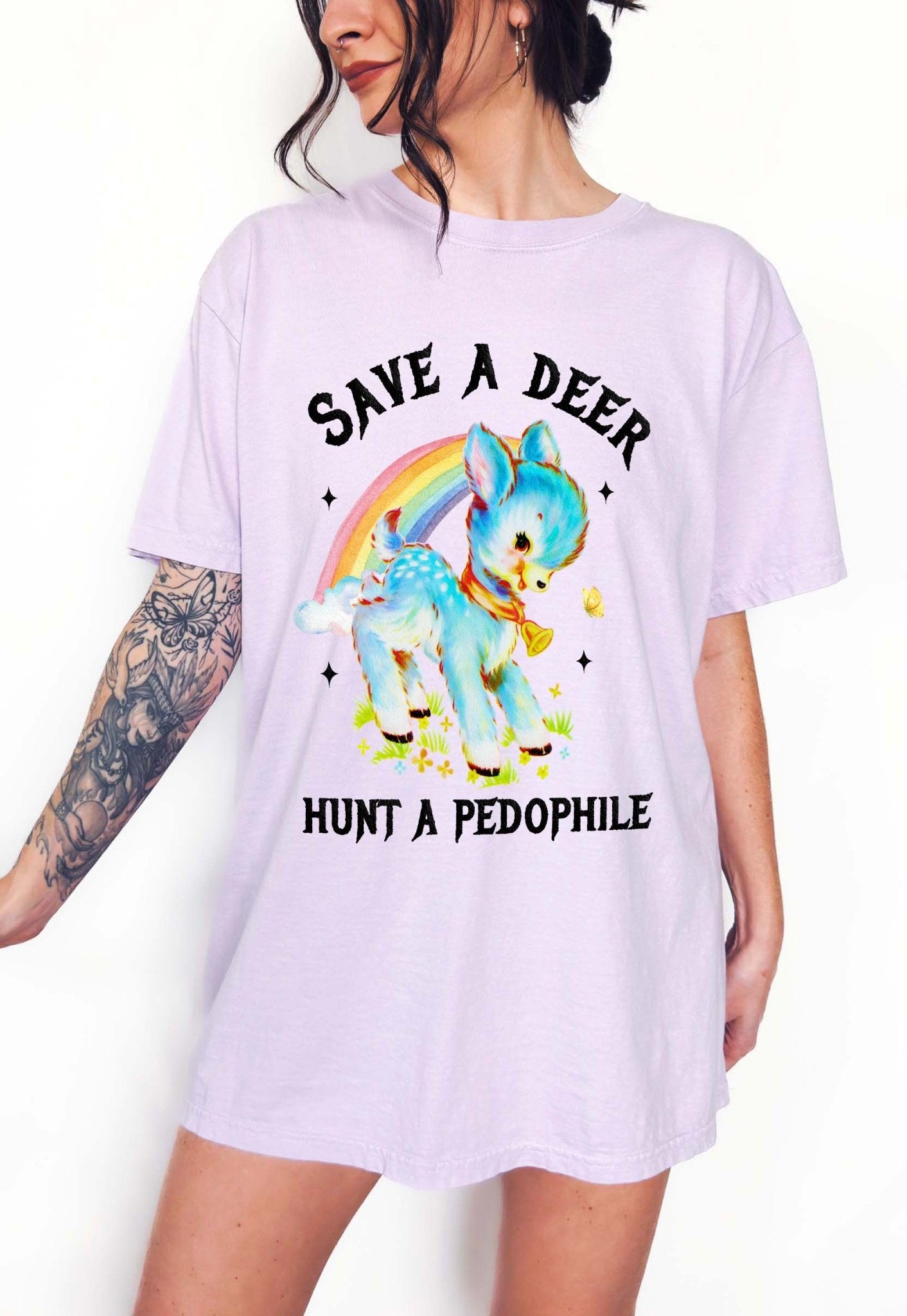 Vintage style deer graphic t-shirt with rainbow design and bold statement text, worn oversized on a model