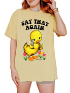 Funny graphic t-shirt with cute duck holding knife and text saying say that again