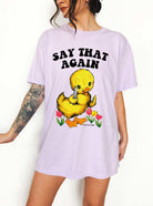 Funny graphic t-shirt with cute duck holding knife and text saying say that again