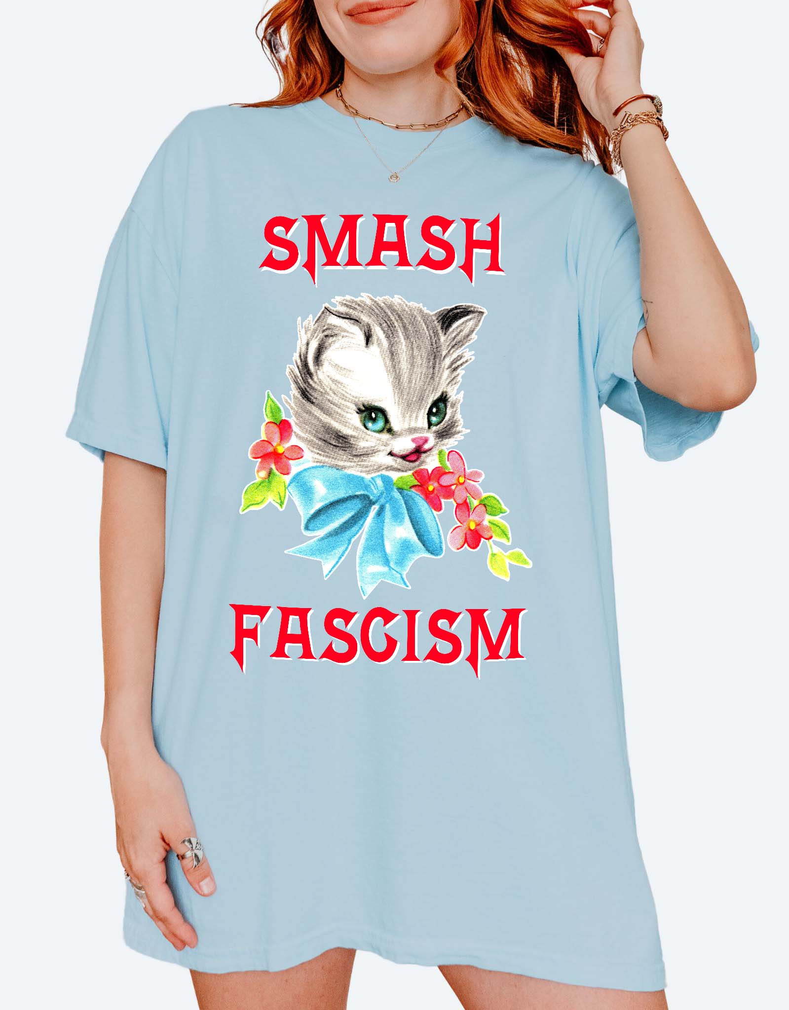 Graphic t-shirt with cute cat illustration and bold protest text reading smash fascism