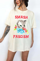 Graphic t-shirt with cute cat illustration and bold protest text reading smash fascism