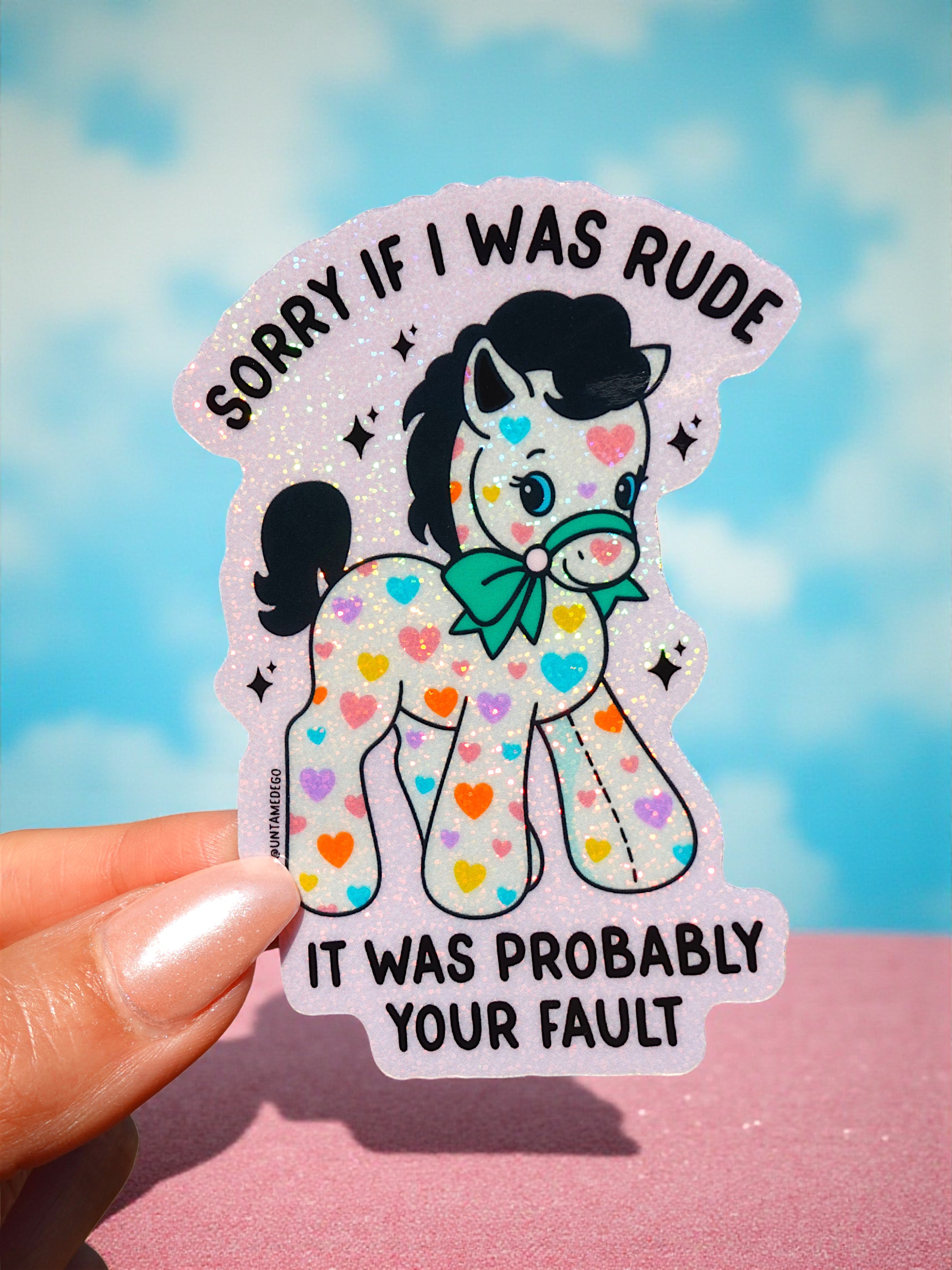 Holographic vinyl sticker featuring a pony with colorful hearts and sarcastic text