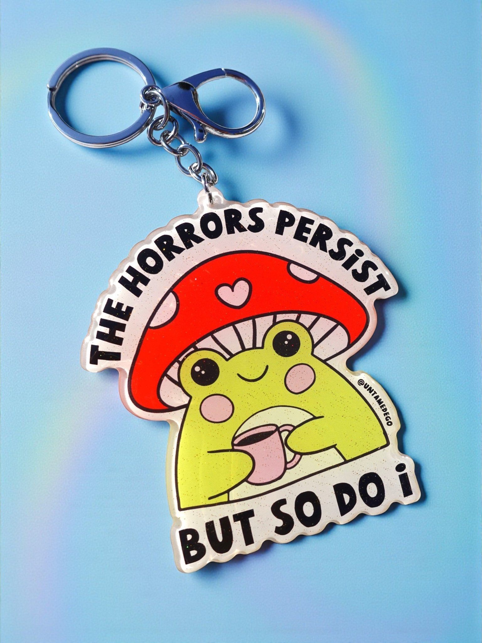 The Horrors Persist But So Do I Keychain | Holographic Glitter Acrylic Keychain - UntamedEgo LLC.
