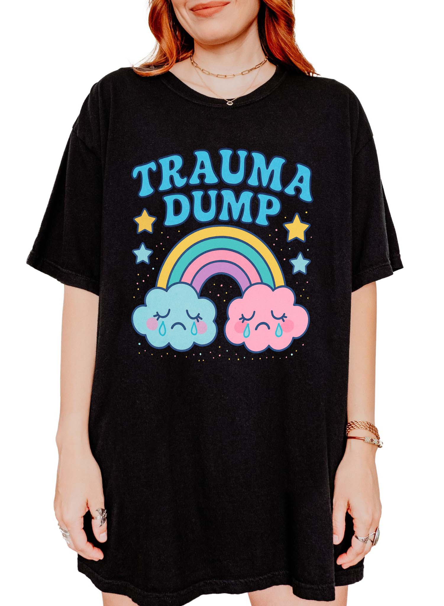 Funny graphic t-shirt with rainbow and crying clouds design and text saying trauma dump
