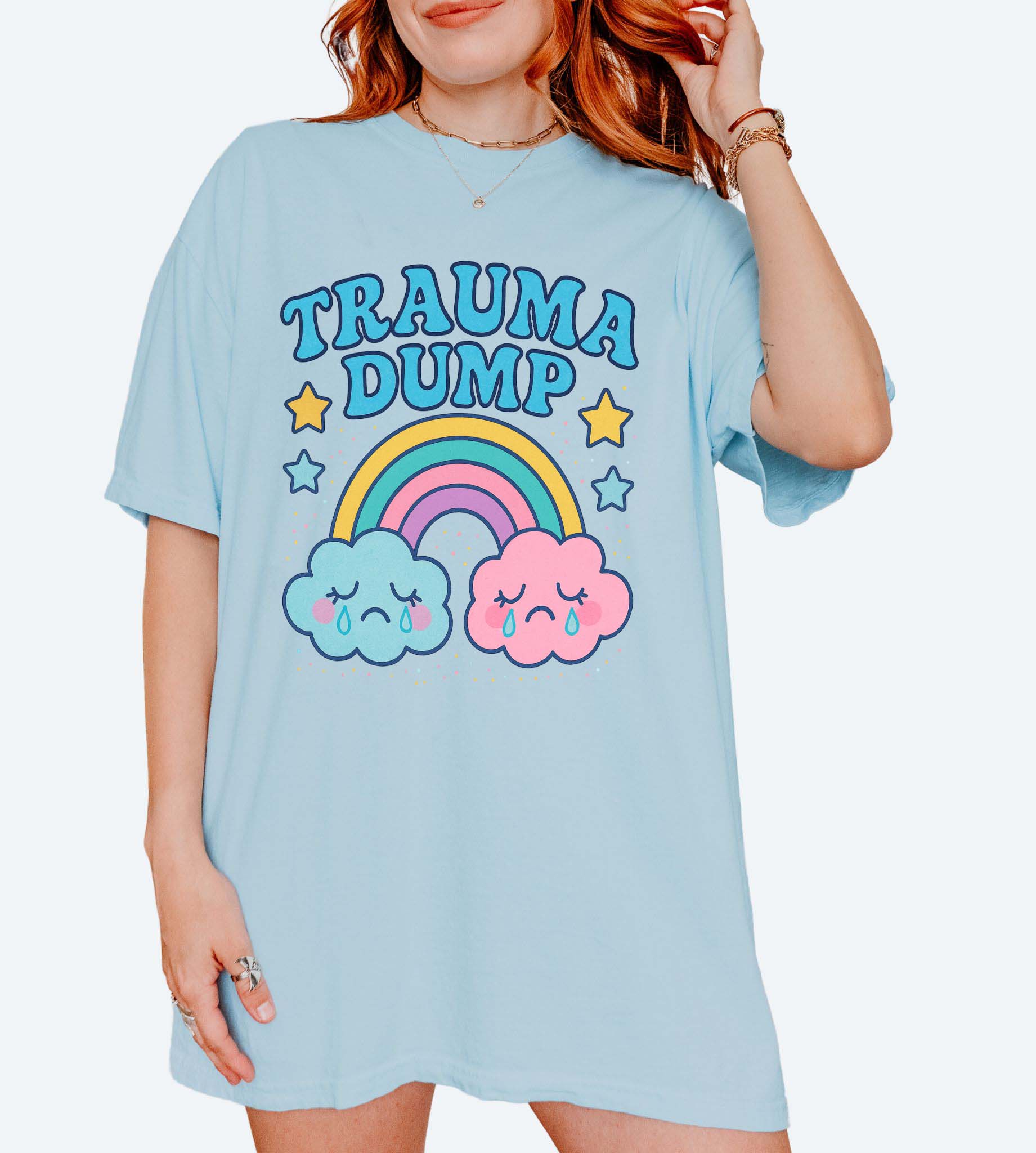 Funny graphic t-shirt with rainbow and crying clouds design and text saying trauma dump