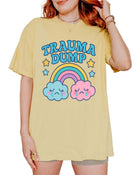 Funny graphic t-shirt with rainbow and crying clouds design and text saying trauma dump
