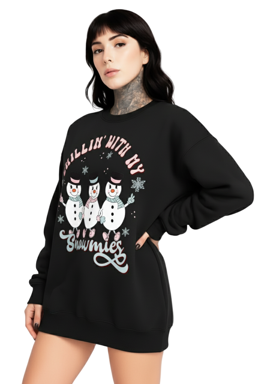 Person wearing a black sweatshirt with snowman graphic and text on a white background