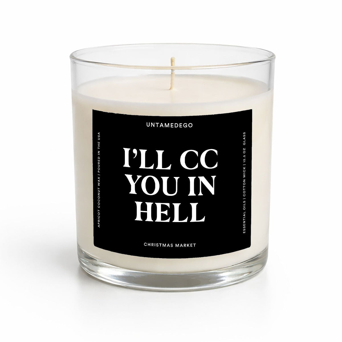 A clear glass jar candle with cream-colored wax and a black square label that reads 'I'LL CC YOU IN HELL' in white text, shown on a clean white background.