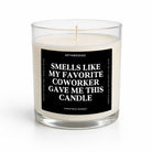 A white wax candle in a clear glass jar with a black label that reads 'SMELLS LIKE MY FAVORITE COWORKER GAVE ME THIS CANDLE' by Untamedego, on a white background.