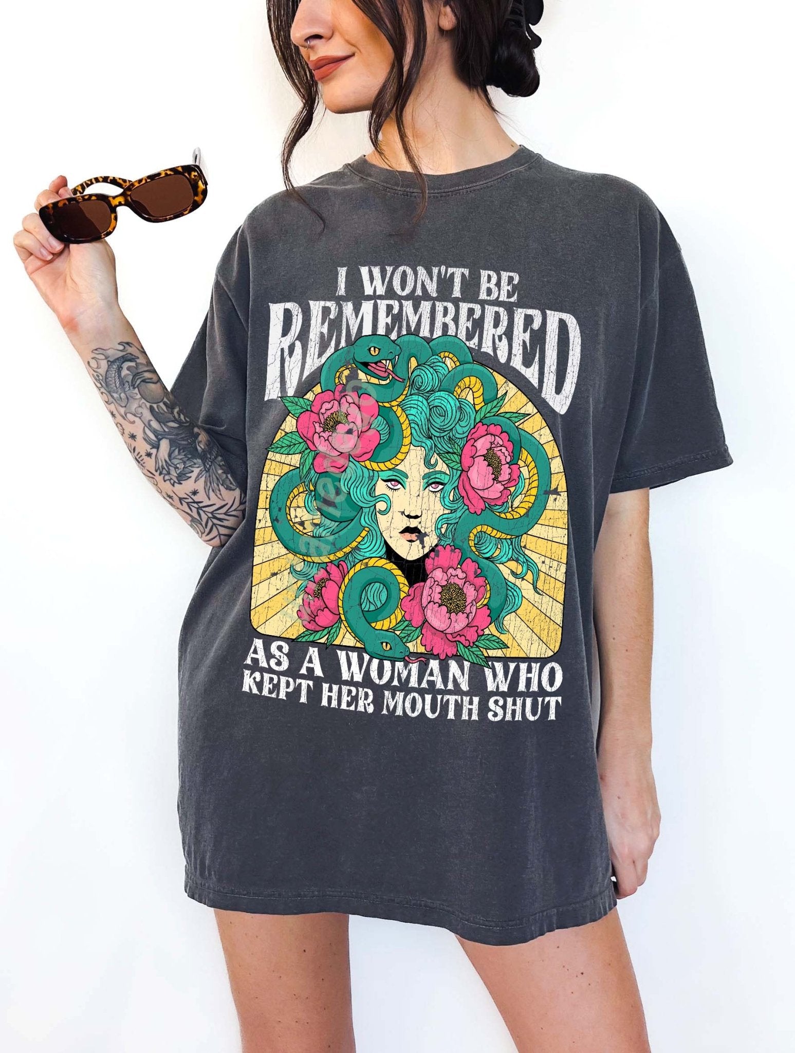 Women empowerment graphic t-shirt with Medusa design and bold feminist statement text