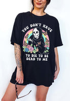 Funny dark humor t-shirt with skeleton graphic and text saying you don’t have to die to be dead to me