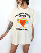 Funny sarcastic black t-shirt with retro heart and rainbow graphic reading I believe in holding grudges I’ll heal in hell