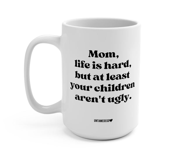 https://www.untamedego.com/cdn/shop/products/mom-life-is-hard-but-at-least-your-children-arent-ugly-15oz-mug-559045_grande.jpg?v=1680399073