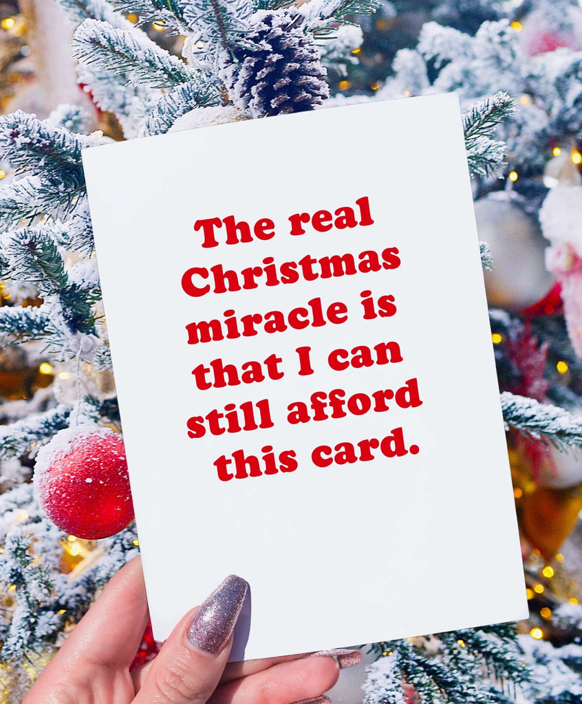 The Real Christmas Miracle Is That I Can Still Afford This Card Greeting Card - UntamedEgo LLC.