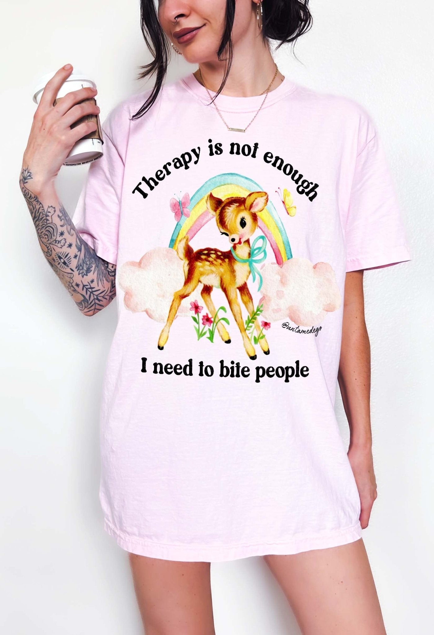 Funny graphic t-shirt with cute deer illustration and text saying therapy is not enough I need to bite people